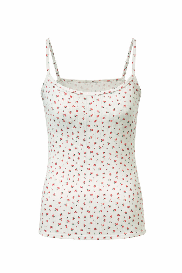 White camisole with red floral pattern on a white background