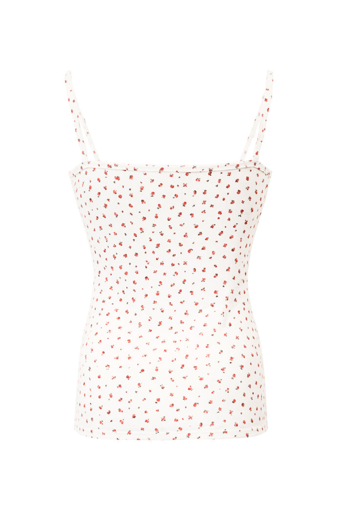 White camisole with red floral pattern on a white background
