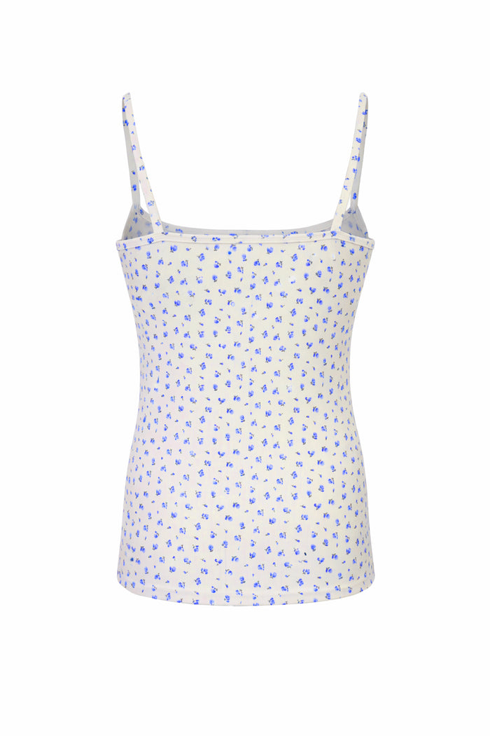 White camisole with blue floral pattern on a white background