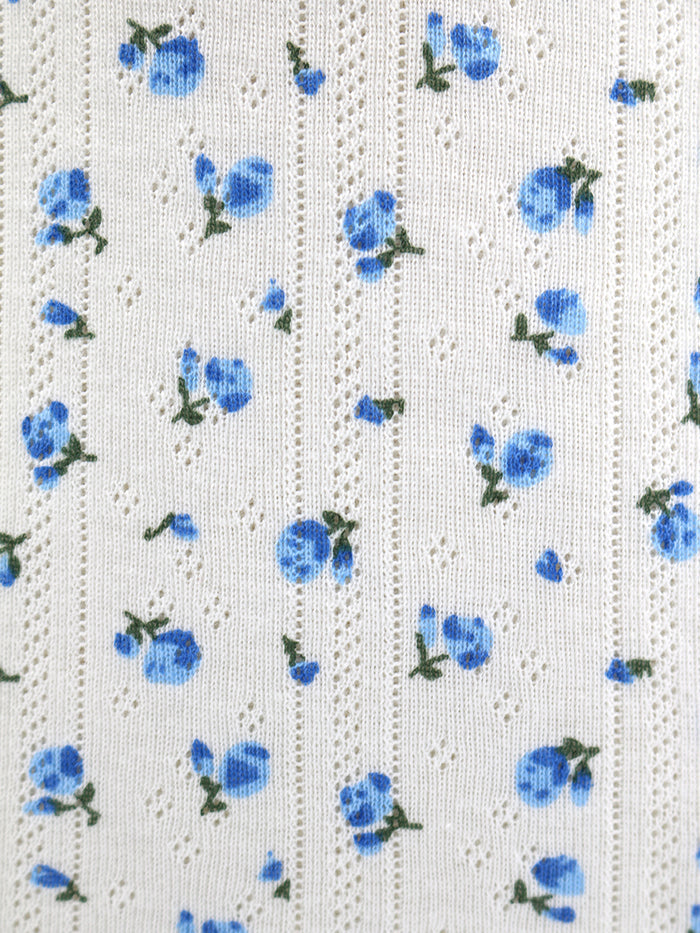 White fabric with blue floral pattern
