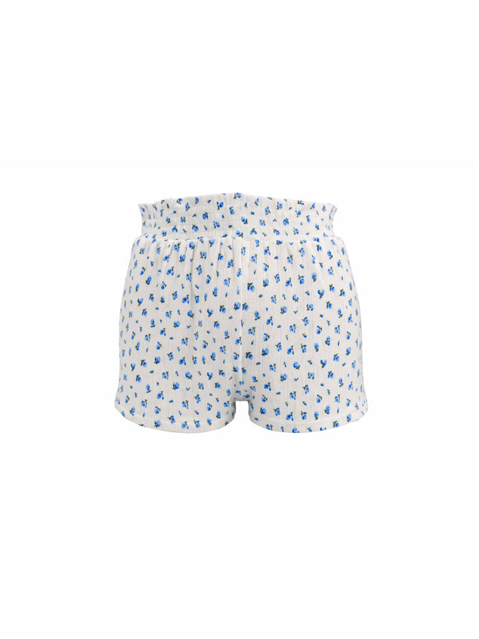 White shorts with blue floral pattern on a white background