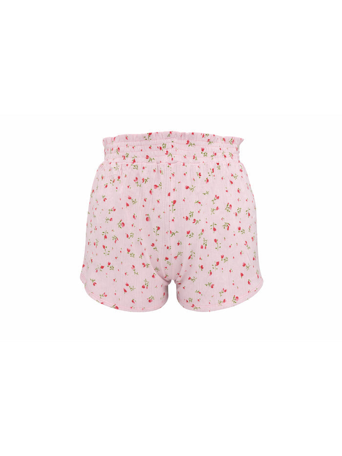 Pink floral shorts on a white background