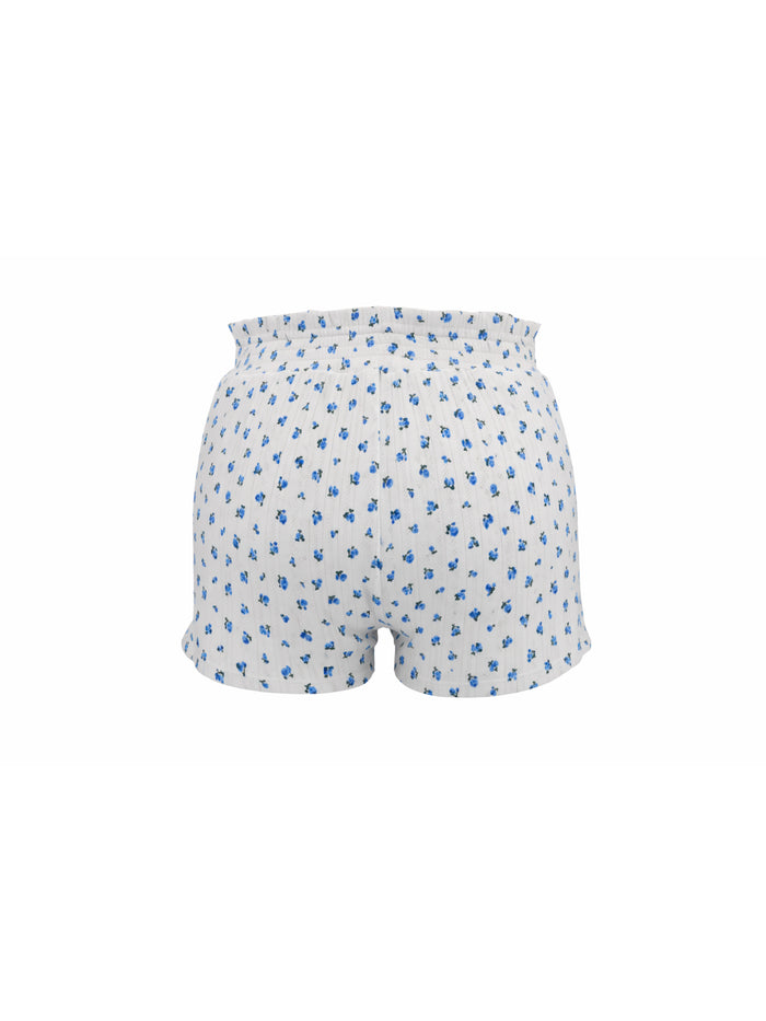 White shorts with blue floral pattern on a white background