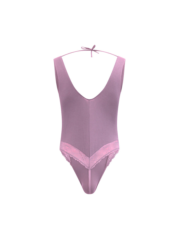 Rear view of purple XDress men's lingerie on a white background.