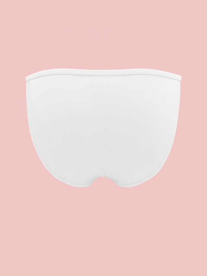 White XDress men's panties on a pink background.